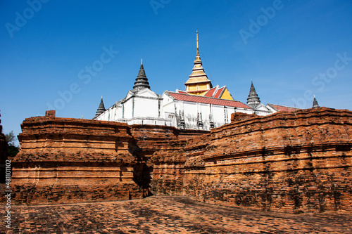 Ancient ruins antique castle and stone brick building of Wat Prasat Nakhon Luang Temple for thai people and foreign travelers travel visit respect praying buddha in Phra Nakhon Si Ayutthaya  Thailand