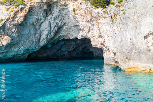 White-stoned rocks creating cave in Corfu island sea beach