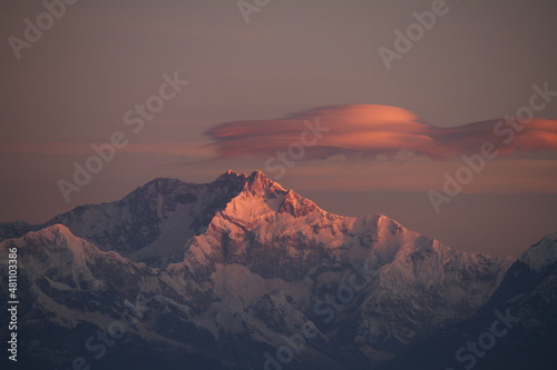 Dawns first glimpse reflected on the mighty Mt. Kanchenjunga. The highest peak of the Himalayan range in India. Taken from one of the top most points of Darjeeling , India at Tiger Hill view point. 
