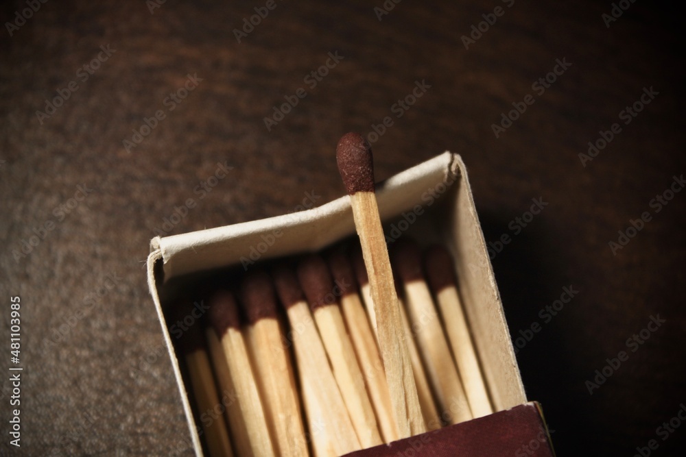 focused matches stick in a matchbox 