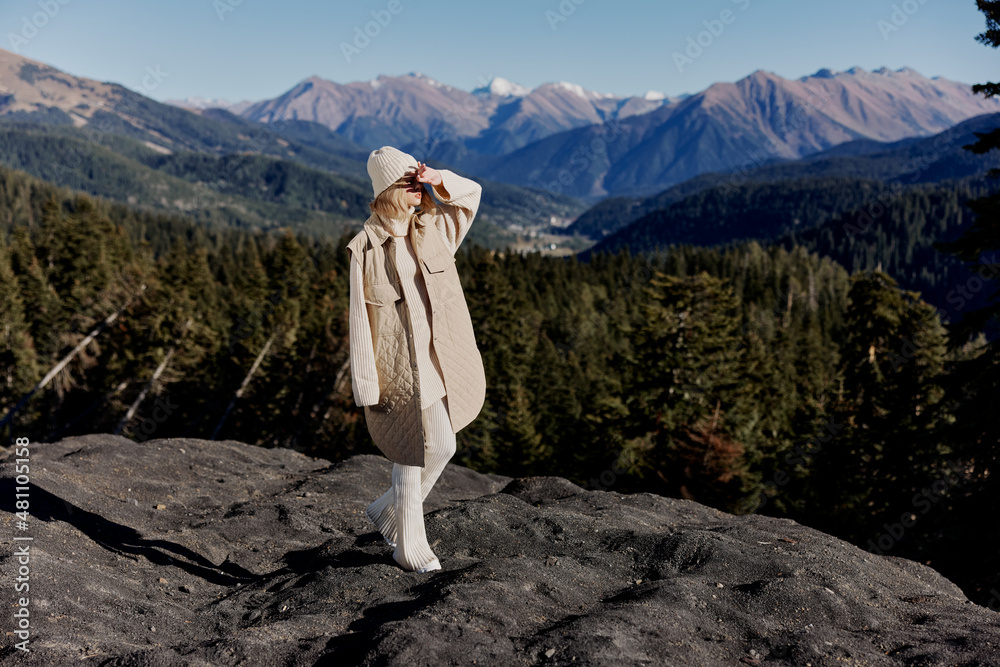 Naklejka premium tourist Standing on the edge of a cliff nature travel relaxation