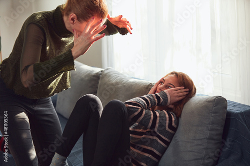 Bild auf Leinwand Teenage girl in difficult mood with angry mom.