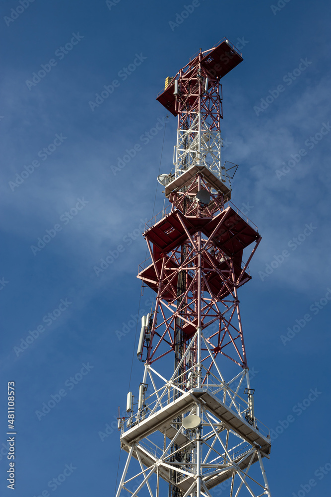Telecommunications antenna for radio, television and telephony whit cloud and Blue sky Telecommunications antenna for radio, television and telephony whit cloud and Blue sky