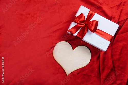 Heart and gift box with a colored background