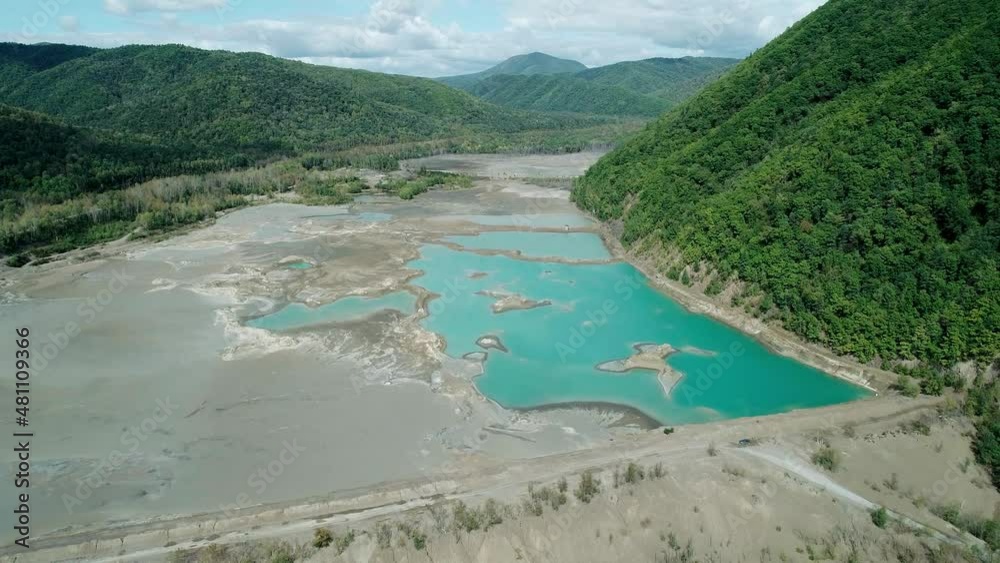 Aerial view of an open-cast mine. Toxic leaks in abandoned tailing dam. An industrial waste disposal. Damaging water resources. Environmental pollution Aerial view of an open-cast mine. Toxic leaks in abandoned tailing dam. An industrial waste disposal. Damaging water resources. Environmental pollution