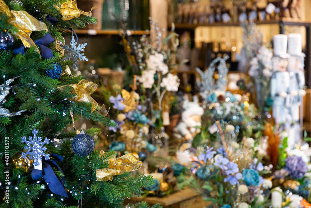 Flower shop on the eve of Christmas. Sale of Christmas decorations for the Christmas tree.