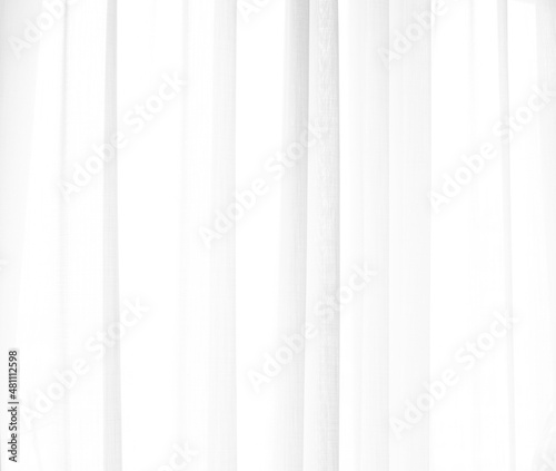 White background with elegant drapery fabric through bright window