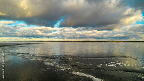 Aerial view of seagulls on a frozen lake