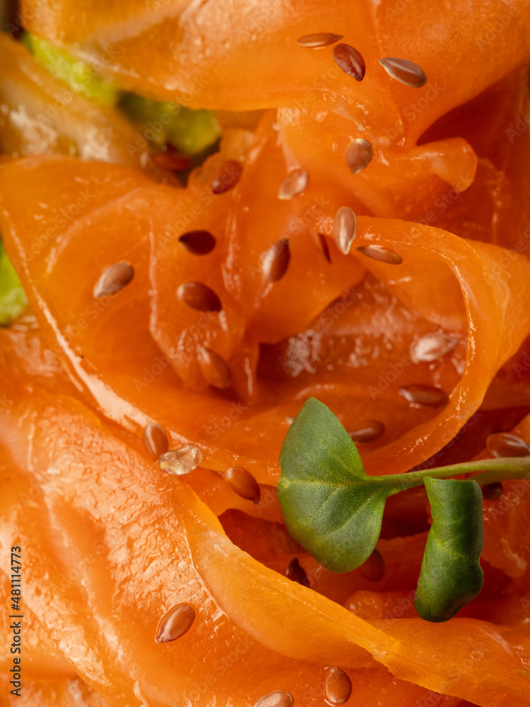 Closeup salmon fish slice on sandwich Closeup salmon fish slice on sandwich