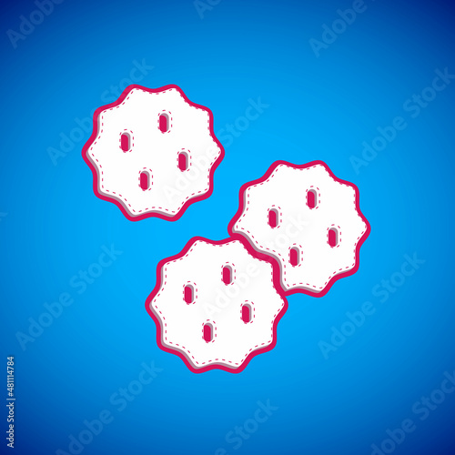 White Cookie or biscuit with chocolate icon isolated on blue background. Vector
