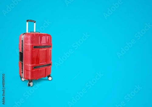 Colorful travel bag on blue background