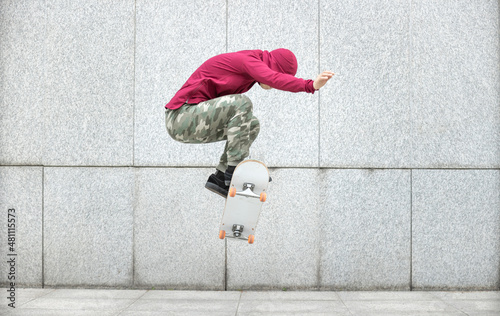 Skateboarder skateboarding outdoors in city photo