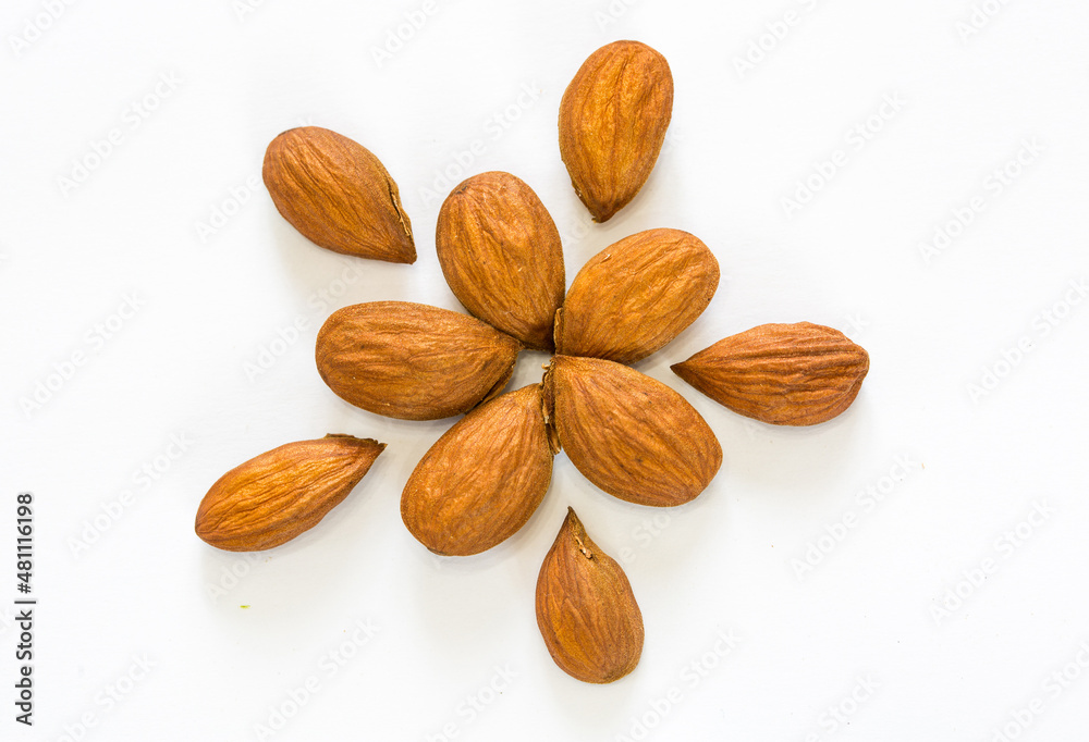 Almond kernels and nuts on a white background isolated Almond kernels and nuts on a white background isolated