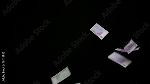 finance, money and wealth concept - euro banknotes flying over black background