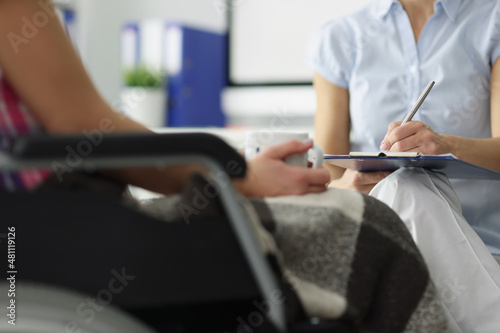 Doctor hold clipboard with patient medical history on appointment