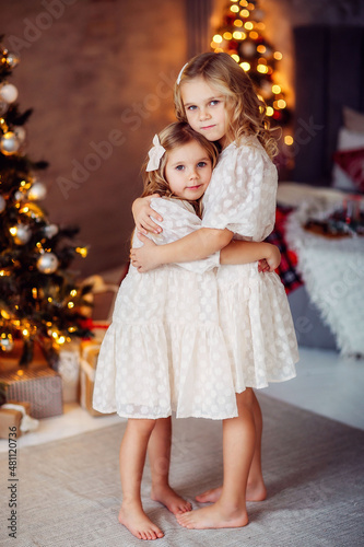 children  new year  new year s interior  christmas tree  photo shoot in the studio  family  sisters