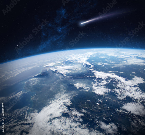Fototapeta Naklejka Na Ścianę i Meble -  Comet and Earth. Elements of this image are furnished by NASA.