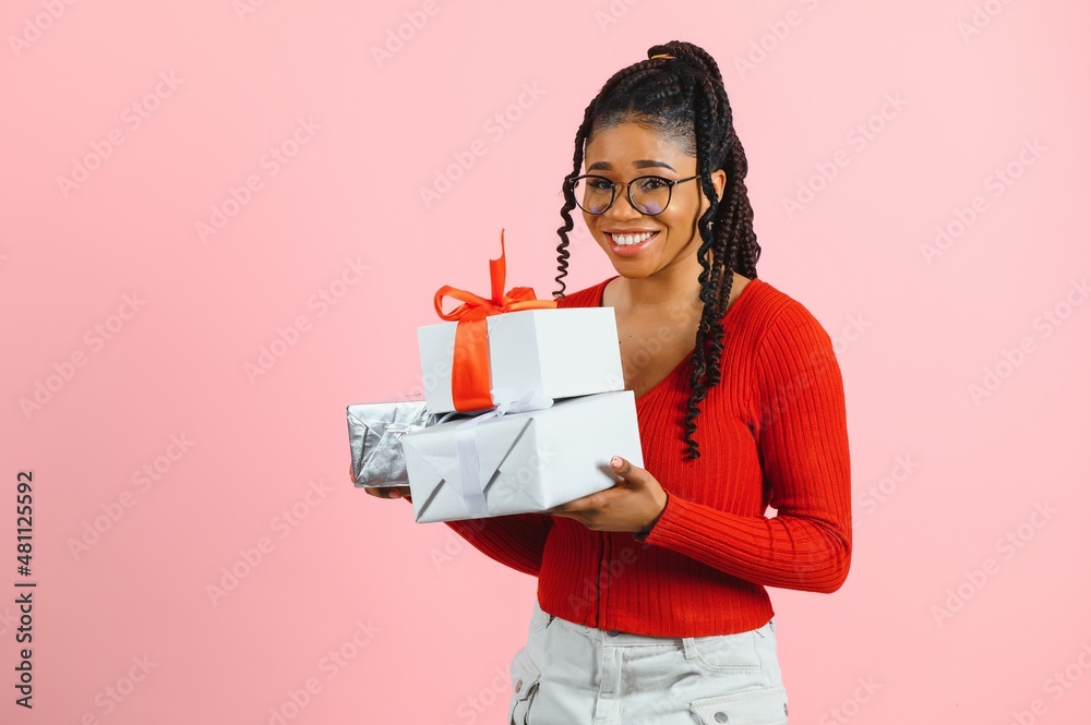 Photo of cheerful positive girl hold gift package isolated pink color background. Photo of cheerful positive girl hold gift package isolated pink color background.