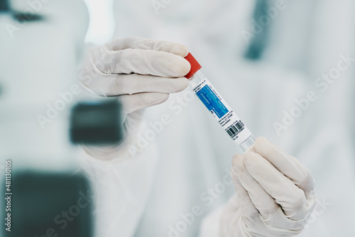 Could this be THE cure. Cropped shot of a scientist holding a vial while conducting medical research in a laboratory.