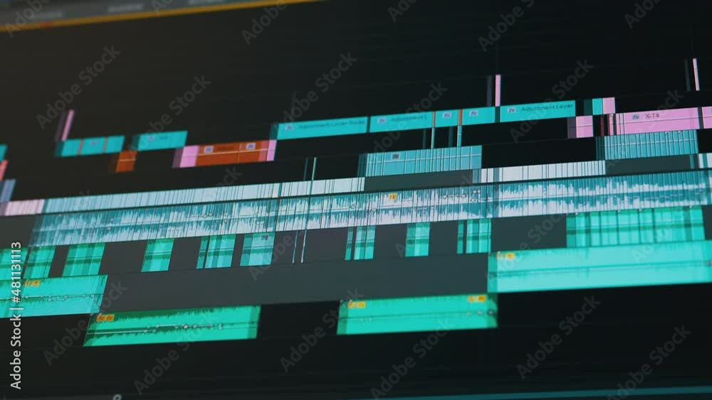 Correction, Editing Audio Layers Played on the Soundtrack on a Computer Screen. Movement adjustment layer pocket. Graph, tracks. Work in application on a laptop with music files in a recording studio.