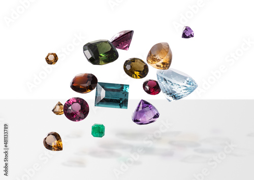Flying perfect faceted gems with shadows. Shining luxury jewels. Composition one