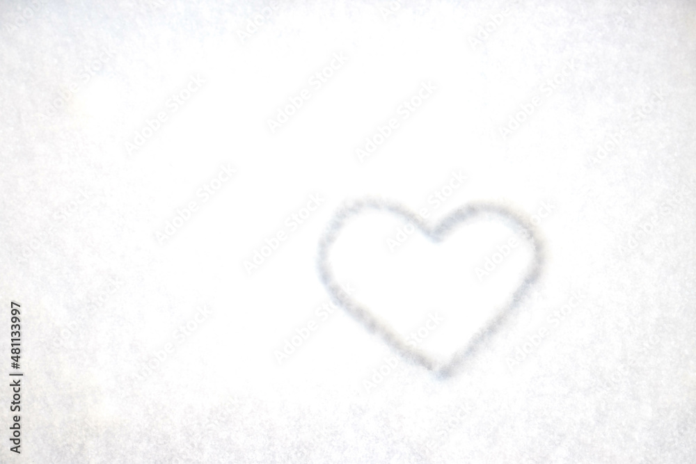 The heart is drawn on fresh snow. The concept of love and romance. Valentine's Day. Winter background
