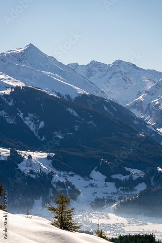 view of the snow capped alps, the hohe tauern in the national park in austria, at a clear sunny winter day