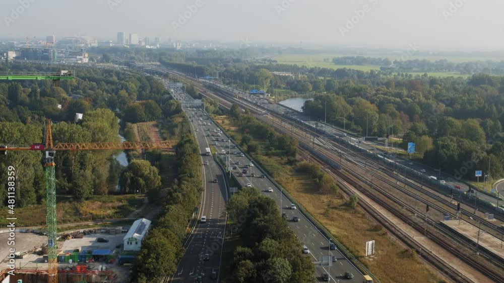 aerial view of a highway infront of a the city aerial view of a highway infront of a the city