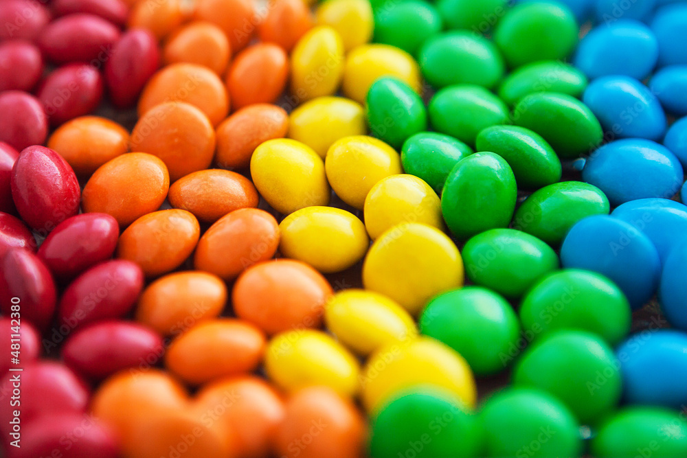 Close up of rainbow colored candy, sugar coated candies. Candy delicious sweets background. Colorfull candies.