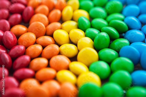 Close up of rainbow colored candy, sugar coated candies. Candy delicious sweets background. Colorfull candies.