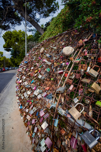 Photos a place with locks put by tourists on a wire fence