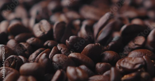 coffee beans close-up cinematic view, macro shot of coffee beans. roasted coffee beans in slow motion.