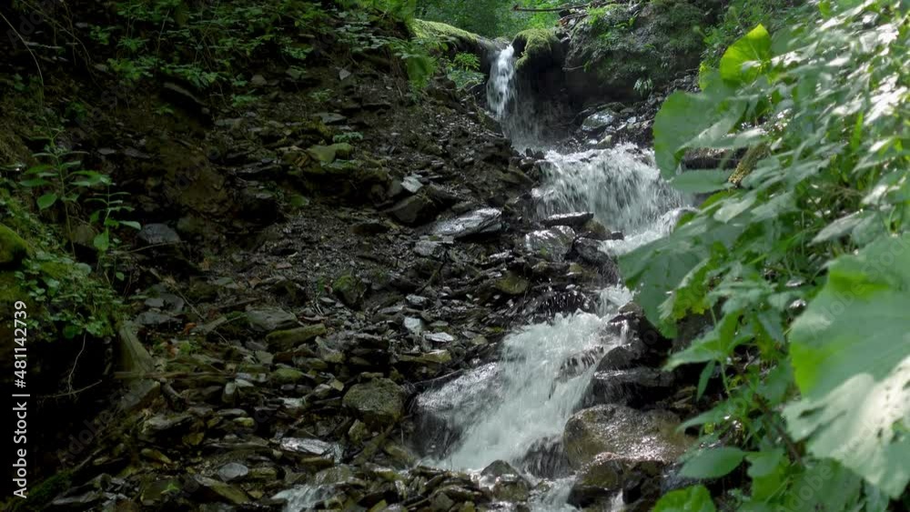 Small waterfalls going over rocks in Caucasian State Natural Biosphere Reserve, a clear-water mountain stream in the Lago-Naki plateau, Russia. Small waterfalls going over rocks in Caucasian State Natural Biosphere Reserve, a clear-water mountain stream in the Lago-Naki plateau, Russia.