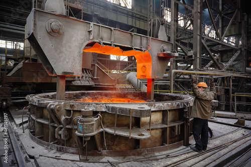 Ladle with hot liquid metal in the Steel ladle degassing unit VD  VOD. Steel production. Metallurgy. Industry photo