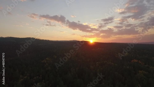 ProRes. Lake Baikal. Olkhon Island. Sunset over the forest. Khuzhir village. Summer shooting from a drone.