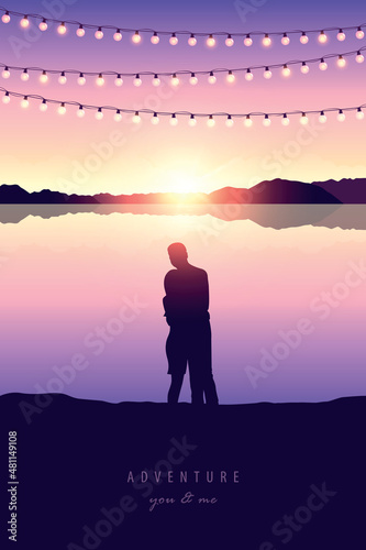romantic couple silhouette by the lake at sunset