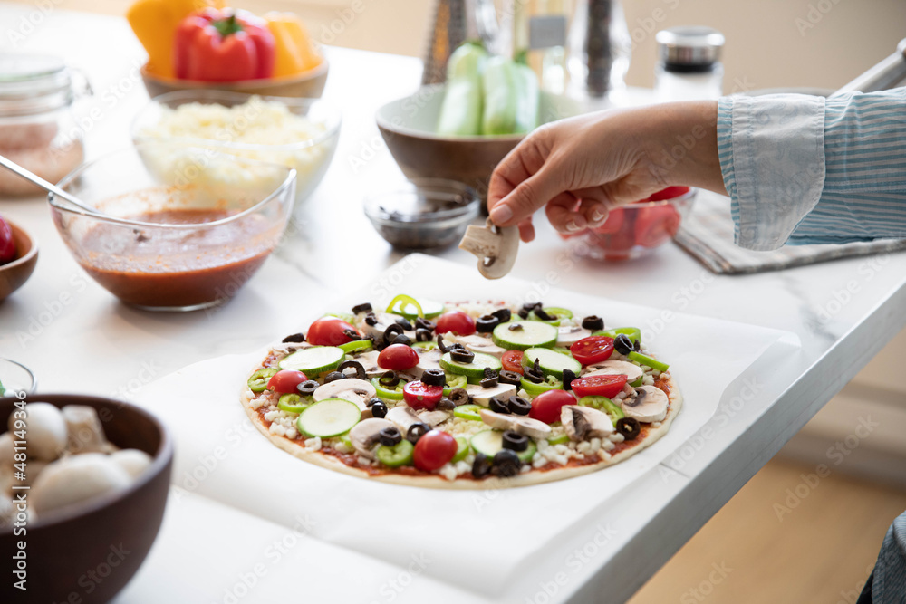 Adding Ingredients To Home Made Pizza Adding Ingredients To Home Made Pizza