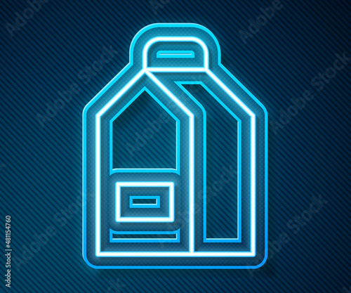 Glowing neon line Paper package for milk icon isolated on blue background. Milk packet sign. Vector