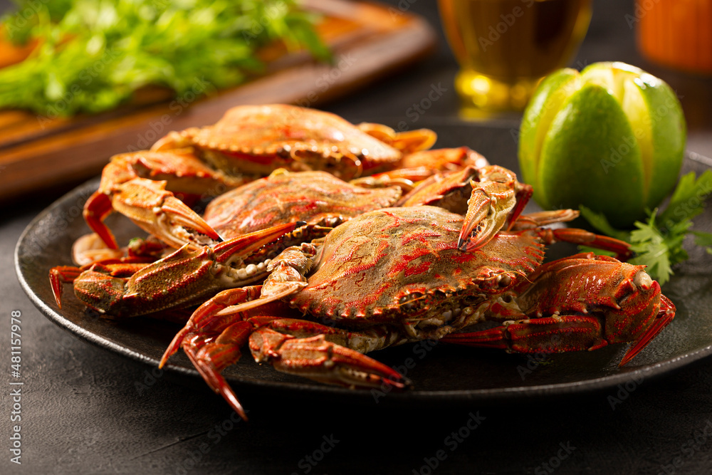 Dish of cooked crabs on the table.