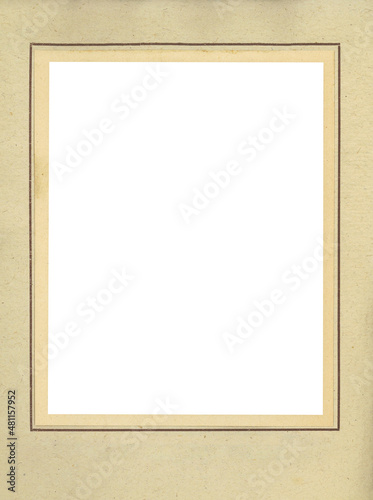 Vintage paper photo frame of an antique photo album with a passepartout bordering a blank space.