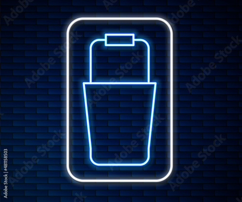 Glowing neon line Sauna bucket icon isolated on brick wall background. Vector