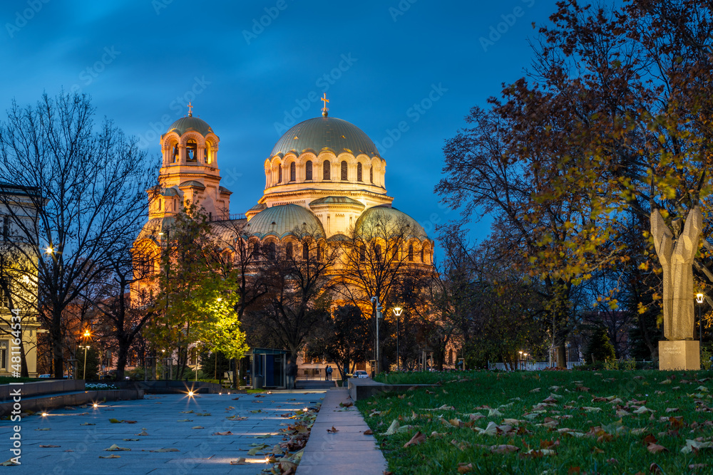 Night view of St. Alexander Nevsky Cathedral from St. Kliment Ohridski Garden. The cathedral is built in Neo-Byzantine style in Sofia, the capital of Bulgaria.