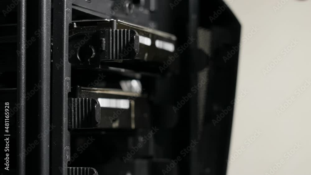 Man replacing and changing old computer hard disks. Computer storage memory Man replacing and changing old computer hard disks. Computer storage memory