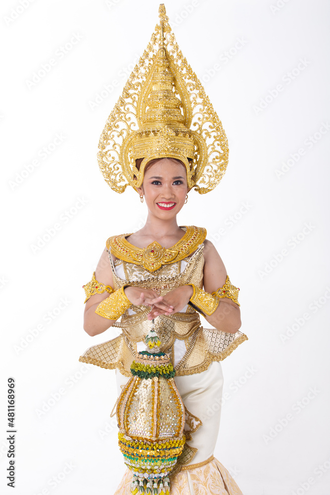 Full length portrait of 20s asian woman wear gold leaf foil and golden dress of National costume