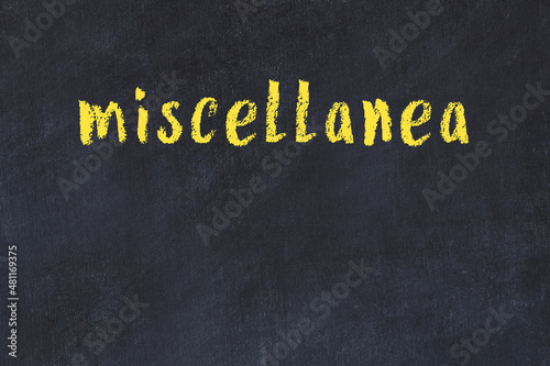College chalk desk with the word miscellanea written on in