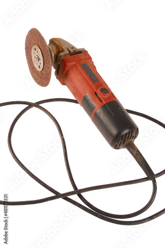 A dirty angle grinder isolated on a white background.