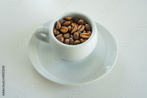 a small coffee in a white cup