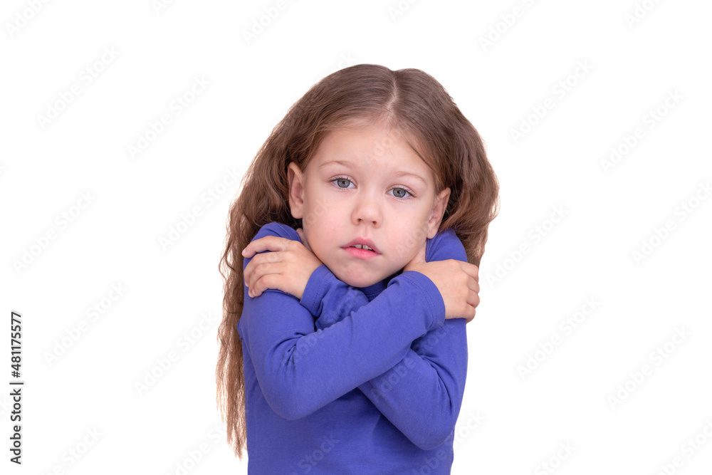Freezing child kid feeling cold holding crossed arms because of coldness, isolated on white background looking at camera waist up caucasian little girl of 5 years in blue Freezing child kid feeling cold holding crossed arms because of coldness, isolated on white background looking at camera waist up caucasian little girl of 5 years in blue
