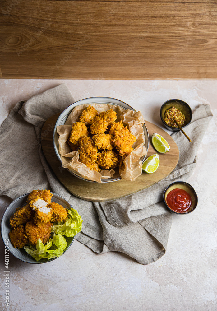 Fototapeta premium vegan chicken nuggets on a table with sides