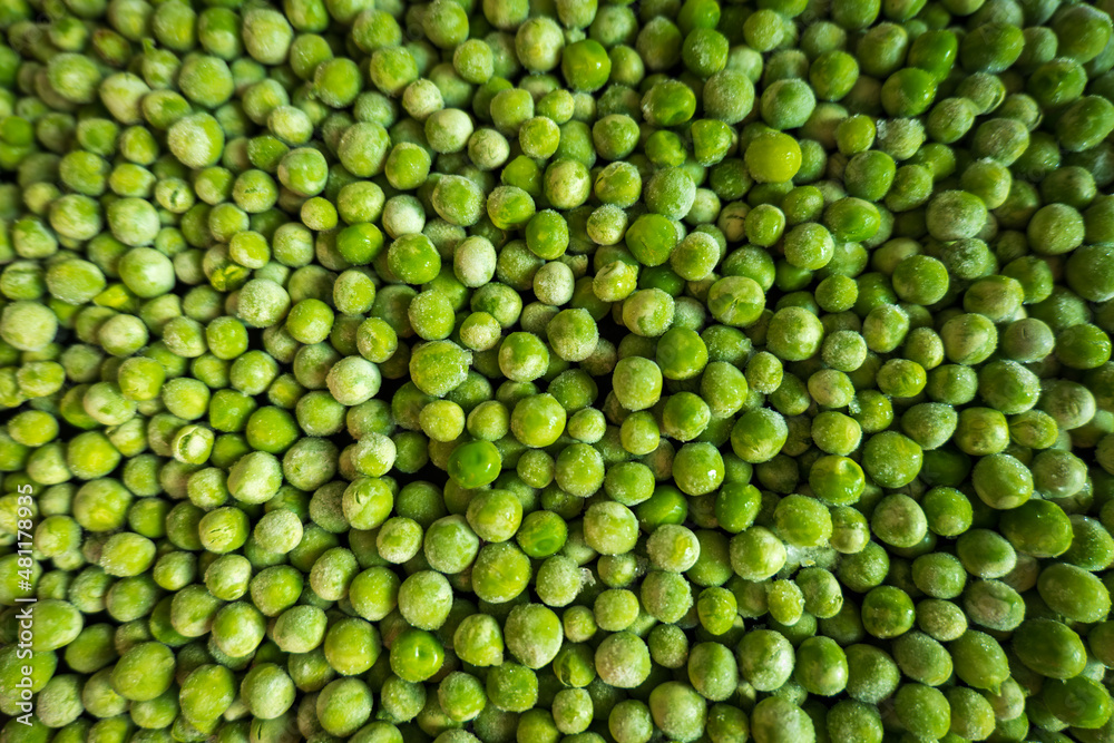 frozen frosty green peas background closeup frozen frosty green peas background closeup
